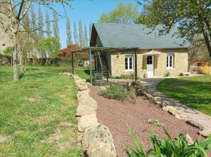 a stone house with a stone path in front of it at Love Room, L'aubertine in Putanges