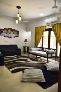 En eller flere senge i et værelse på Home away from Home