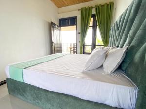 Postel nebo postele na pokoji v ubytování Sana Kuna Holiday Resort