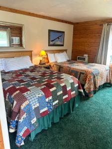 Postel nebo postele na pokoji v ubytování Homer Floatplane Lodge
