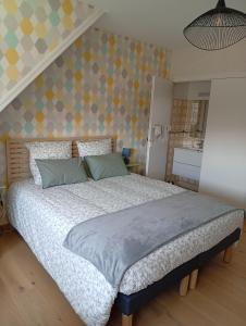 Postel nebo postele na pokoji v ubytování La Manchoise