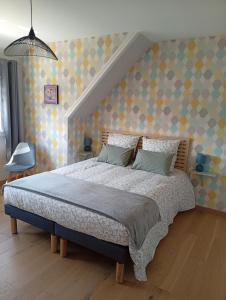 Postel nebo postele na pokoji v ubytování La Manchoise