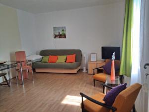 a living room with a couch and a table at Rajj in Bela Crkva