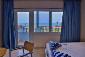 Un pat sau paturi într-o cameră la Tharang Resorts aptdc