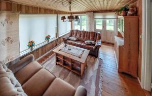 a living room with a couch and a coffee table at 1 Bedroom Gorgeous Home In Ryssby in Ryssby