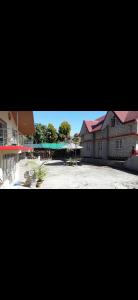 a view of a building with a parking lot at Newachhen homestay in Kalimpong
