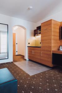 Kuchyň nebo kuchyňský kout v ubytování Ambienthotel Tassilo