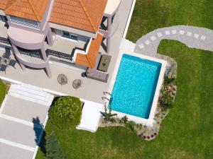 an overhead view of a house with a swimming pool at SunnyVilla Rhodes in Ialysos