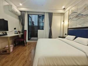 Postel nebo postele na pokoji v ubytování Longchen Hotel