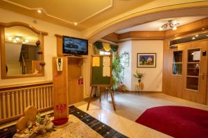 TV a/nebo společenská místnost v ubytování Hotel Persura