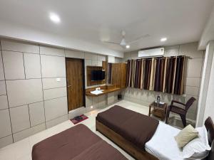 TV a/nebo společenská místnost v ubytování Hotel Sanmati