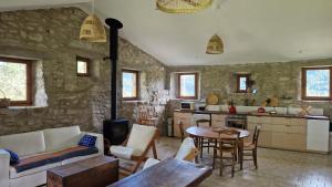a living room with a couch and a table at Gîte de Branchou in Coux