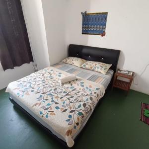 Postel nebo postele na pokoji v ubytování Tabun Homestay