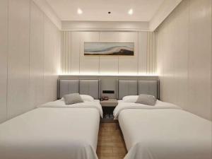 Letto o letti in una camera di Longchen Hotel