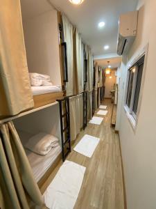 a row of bunk beds in a dorm room at Dream station hostel in Pakse