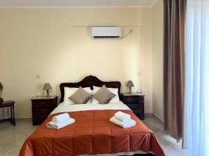 Postel nebo postele na pokoji v ubytování Home Himara