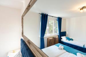 a room with two beds and a window at Sarajevo Midway Premium Brand New Apartment in Sarajevo