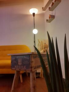 a room with a bed and a table and a plant at Charmante maison atypique in Régusse