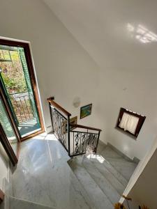 an empty staircase in a house with a window at Al Papavero Rosso in Castellammare di Stabia