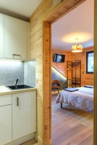 Postel nebo postele na pokoji v ubytování Apart Hôtel des Cols