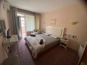 Postel nebo postele na pokoji v ubytování Art Guest House Orchidea