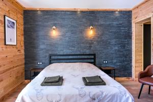 Postel nebo postele na pokoji v ubytování Apart Hôtel des Cols