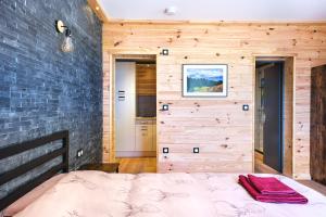 Postel nebo postele na pokoji v ubytování Apart Hôtel des Cols