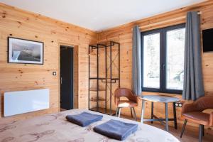 Postel nebo postele na pokoji v ubytování Apart Hôtel des Cols