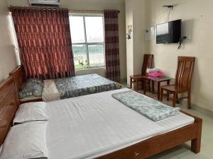 Postel nebo postele na pokoji v ubytování Nhà nghỉ 19 Đền Trần