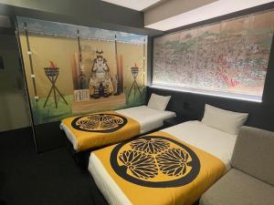 Postel nebo postele na pokoji v ubytování Henn na Hotel Tokyo Asakusabashi