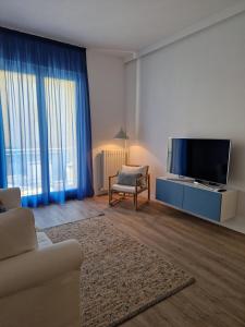 TV a/nebo společenská místnost v ubytování La Cicada