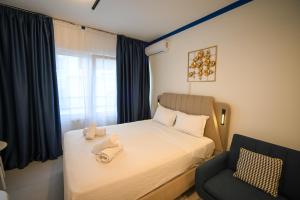 a small bedroom with a bed and a chair at Syntagma Plaka Suite by Zeussuites in Athens