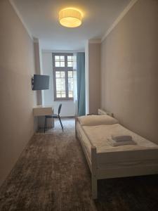 Postel nebo postele na pokoji v ubytování Hotel Pilgrim