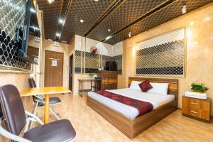 Ένα ή περισσότερα κρεβάτια σε δωμάτιο στο Kings Hotel In City Central