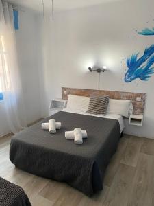 Postel nebo postele na pokoji v ubytování Hotel Bergantí