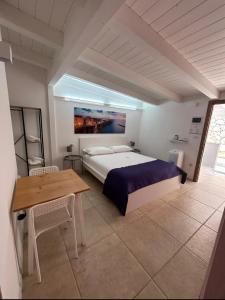 Postel nebo postele na pokoji v ubytování Le Dimore di Mariuccia Relax & SPA