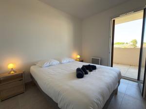 Postel nebo postele na pokoji v ubytování F3 Confort & Piscine 300m de la Plage