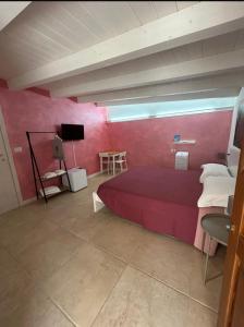 Postel nebo postele na pokoji v ubytování Le Dimore di Mariuccia Relax & SPA