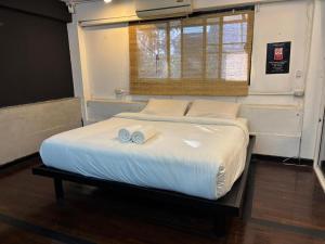 Postel nebo postele na pokoji v ubytování KAYAN Hostel