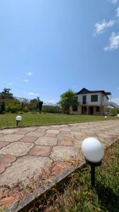 two white objects are sitting on the side of a road at Guesthouse Martvili Canyon 'Kolkhi' 