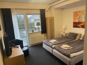 Postel nebo postele na pokoji v ubytování Björnlokan B&B