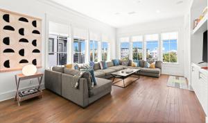 a living room with a couch and a table at Moonstruck in Santa Rosa Beach