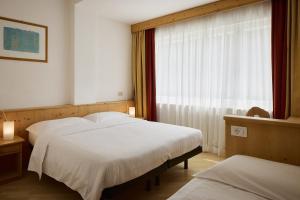 Postel nebo postele na pokoji v ubytování Garni Bellavista
