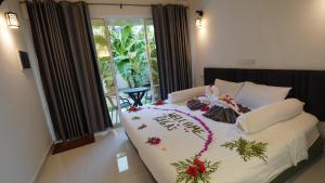 Postel nebo postele na pokoji v ubytování Vegas Thoddoo Maldives