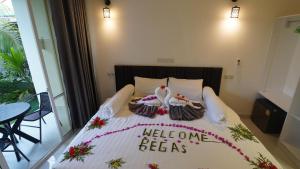 Postel nebo postele na pokoji v ubytování Vegas Thoddoo Maldives