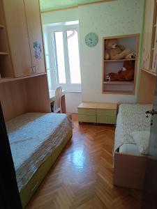 Postel nebo postele na pokoji v ubytování Apartman Paola