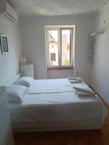 Postel nebo postele na pokoji v ubytování Apartman Paola
