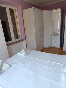 Postel nebo postele na pokoji v ubytování Apartman Paola