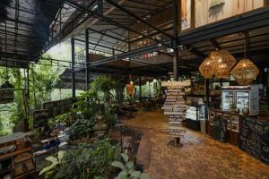 a large greenhouse filled with lots of plants and lights at Mojigao - Eco Resort in Assagao