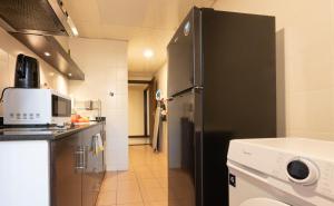 Kuchyň nebo kuchyňský kout v ubytování The Eclipse Boutique Suites